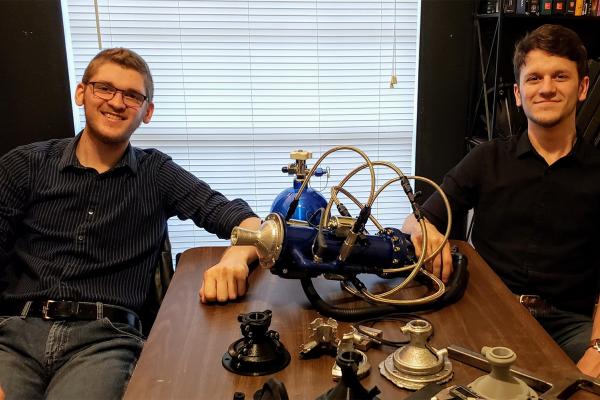 University of New Orleans mechanical engineering students Daniel Elfert (left) and Mitchell Maurin designed and built a hybrid rocket engine.