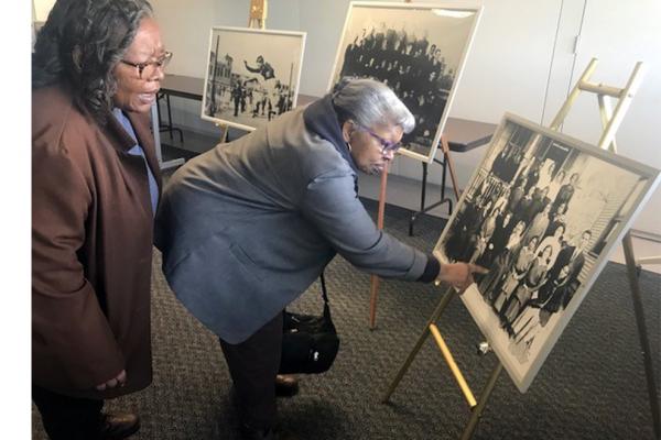 Jenny Branch, left, and her sister Edna Branch look at pictures included in the Orleans Parish School Board Collection housed at the University of New Orleans’ Earl K. Long Library.